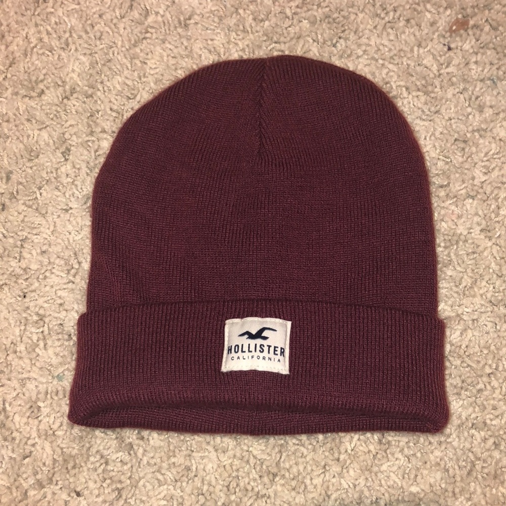 Maroon/red colored beanie hat by Hollister